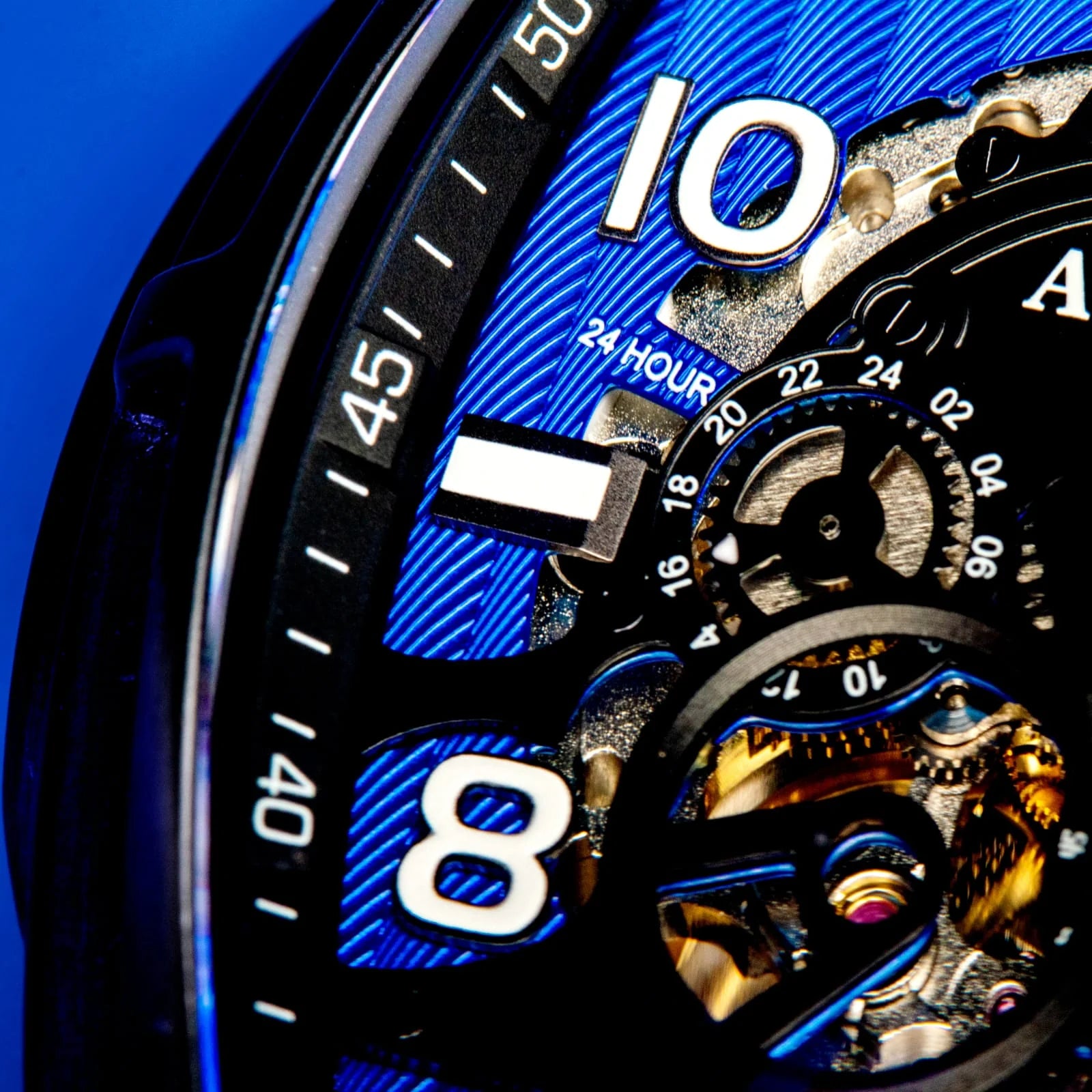 Audaz black and blue watch with skeletonized visible movement close up