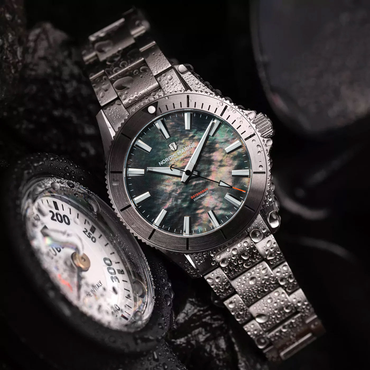 Nordic Marine Instruments watch with natural colorful mother-of-pearl dial on dive gear with water drops
