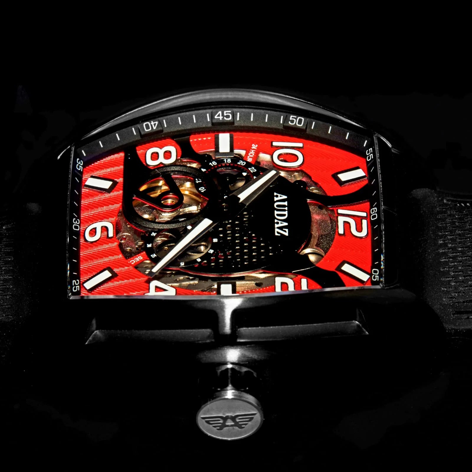 Audaz black and red watch with skeletonized visible movement close up