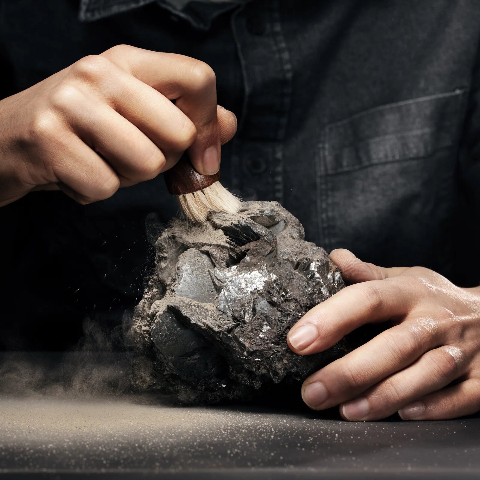 meteorite stone getting brushed