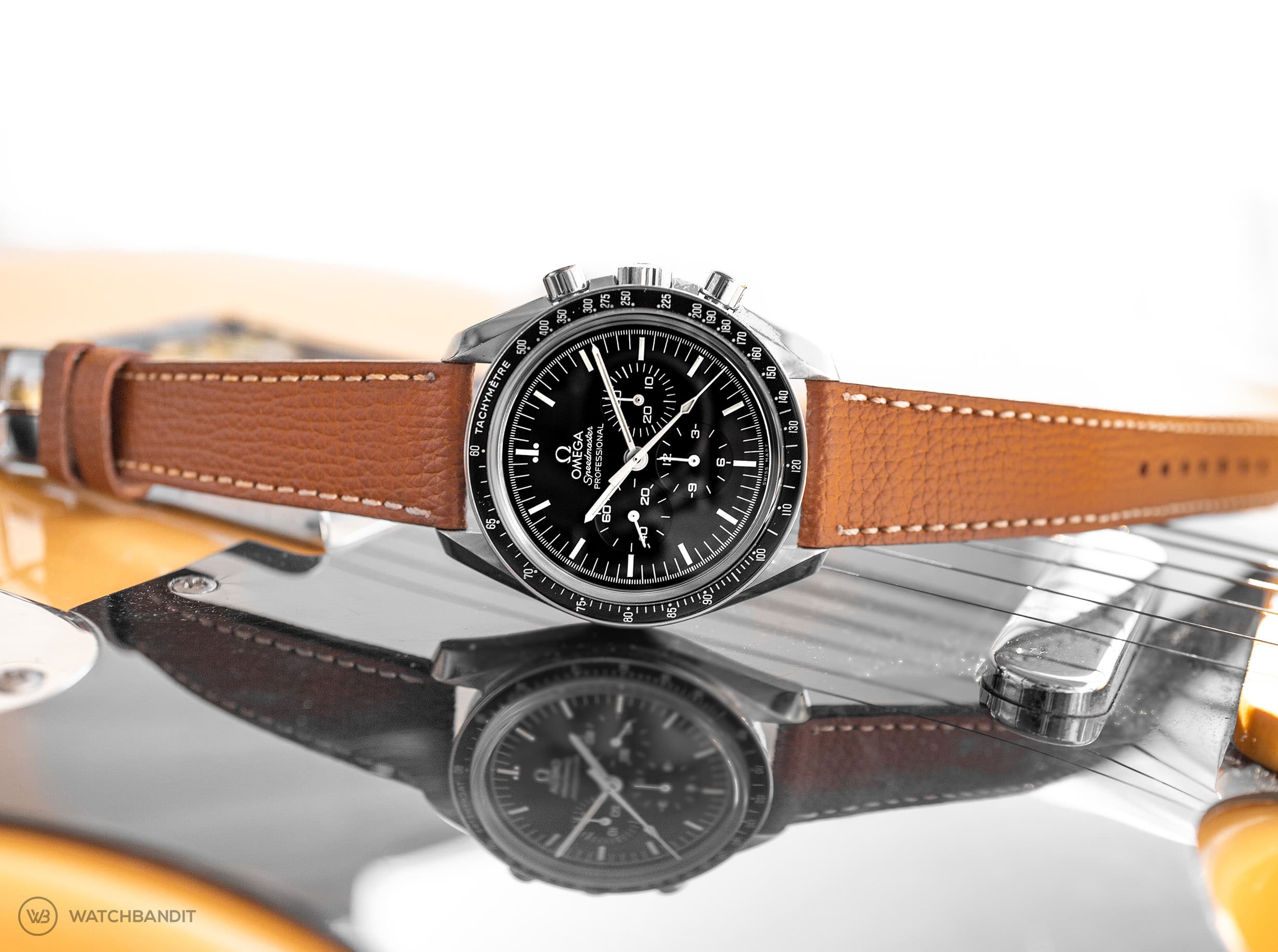 Omega Speedmaster Professional Strap guide textured calfskin leather strap tanned horizontal-min