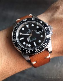 Rolex GMT Master II 116710LN on brown vintage leather strap by WatchBandit