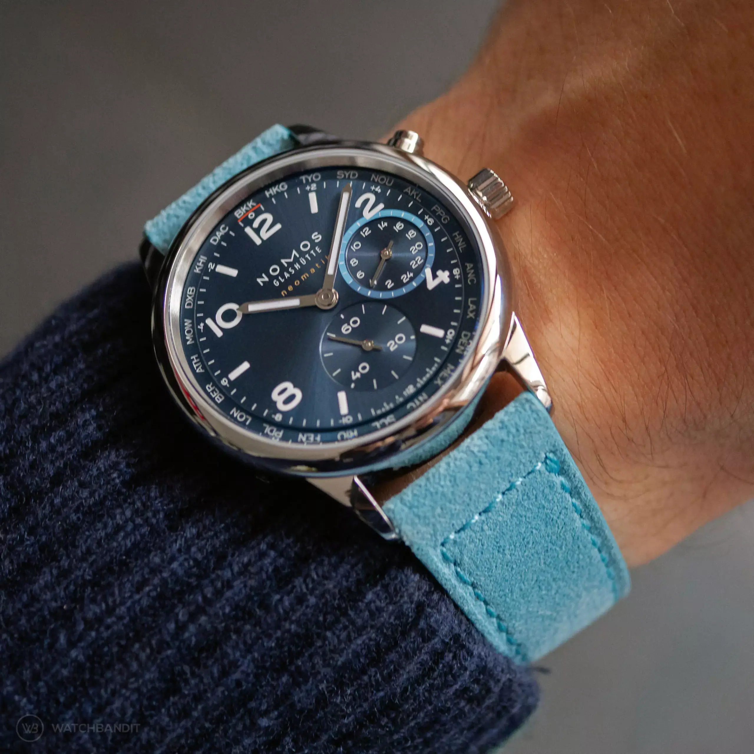 nomos-club-sport-neomatik-worldtimer-strapguide-light-blue-suede-leather-strap