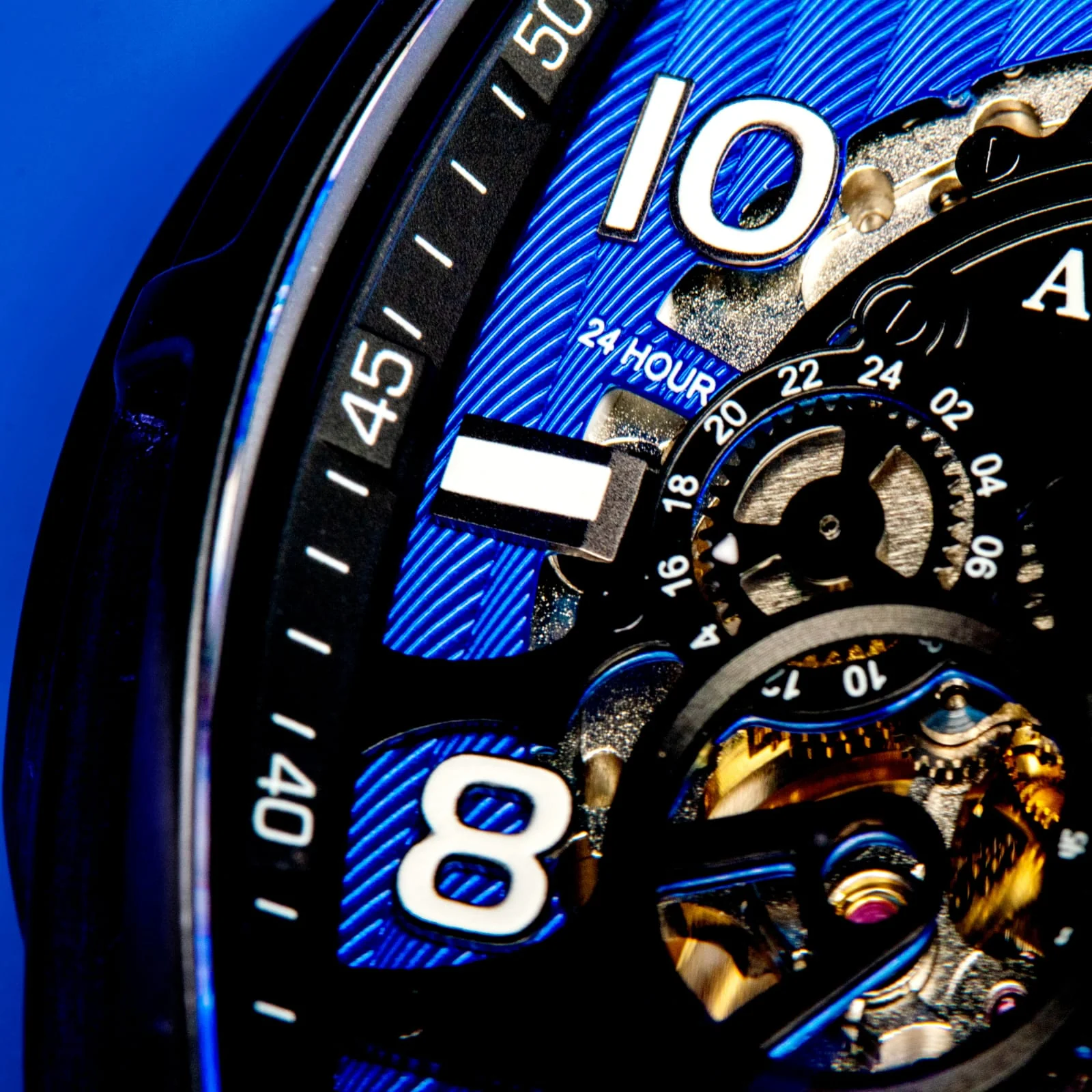 Audaz black and blue watch with skeletonized visible movement close up